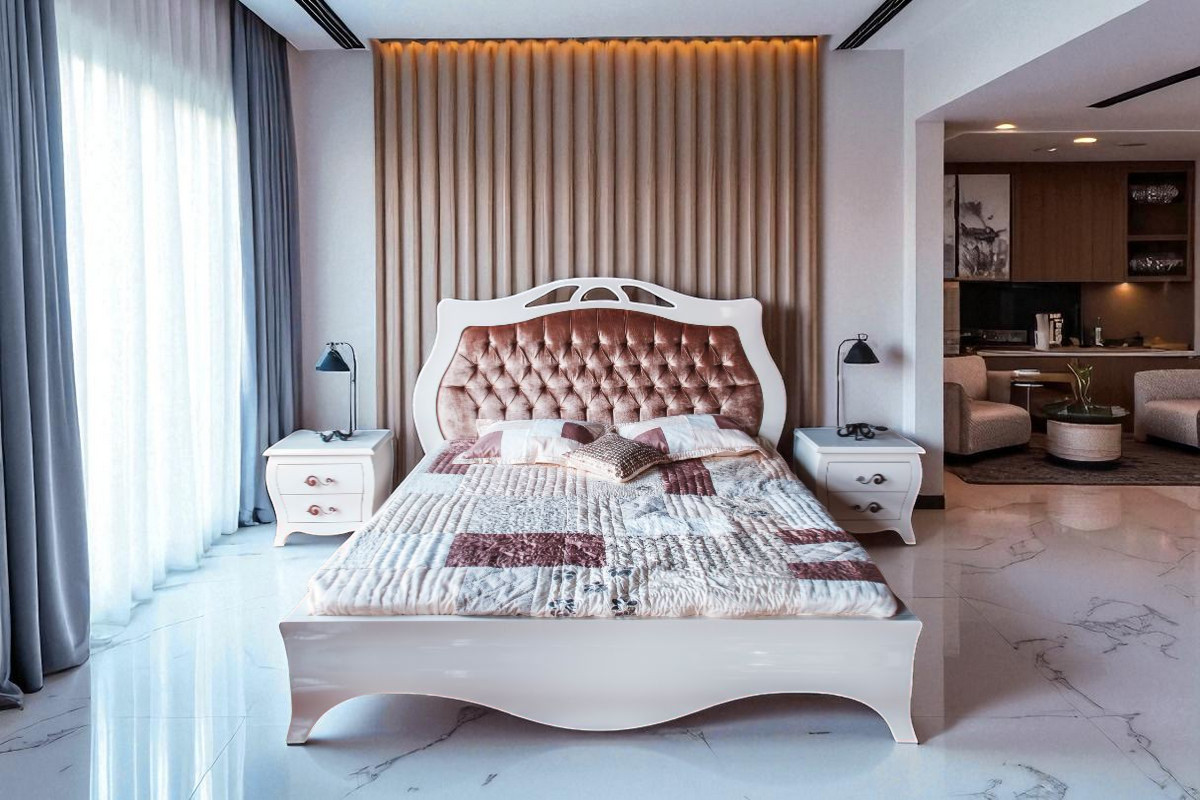 Elegant cotton bed cover with floral print design, neatly spread on a modern king-size bed in a cozy bedroom setting – Hometex Bangladesh